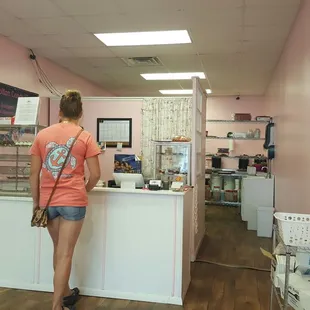 a woman standing at a counter