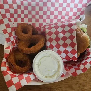 Mushroom Swiss burger with onion rings.