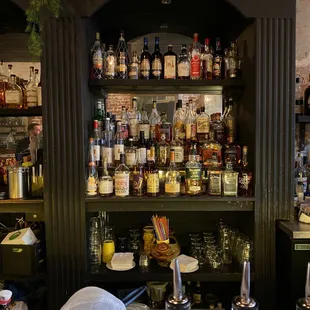 a bar filled with bottles of alcohol