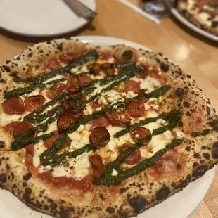 Pizza of the month! Pesto, pepperoni, goat cheese and red sauce