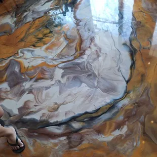 feet and marbled looking floors