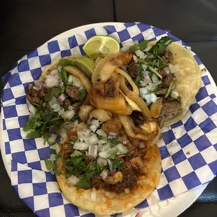 Carne asada tacos and a birria taco.