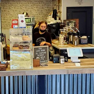 a woman behind the counter