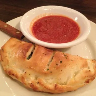 $1.95 calzone!!   Not bad for $1.95.  It is around 6" across for a size reference.