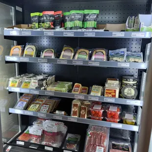 a display of meat and cheeses