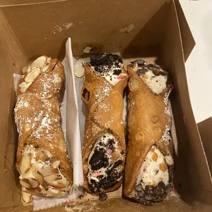 a variety of pastries in a box