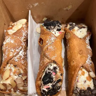 a variety of pastries in a box