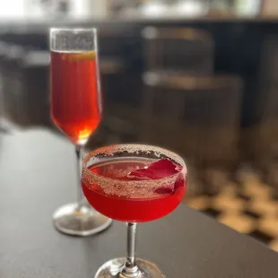 two glasses of wine on a table