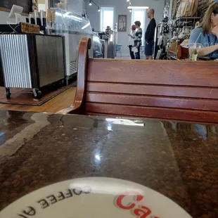 a woman sitting at a table in a restaurant