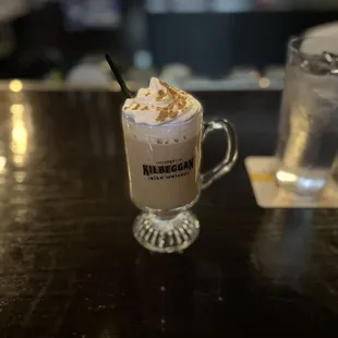 a cup of coffee with whipped cream