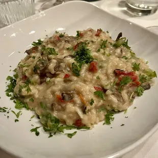 From the 2023 holiday musical show menu:  Course 4 -- vegetarian mushroom risotto with sun-dried tomatoes.