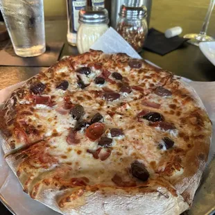 Italian meats pizza with Kalamata olives