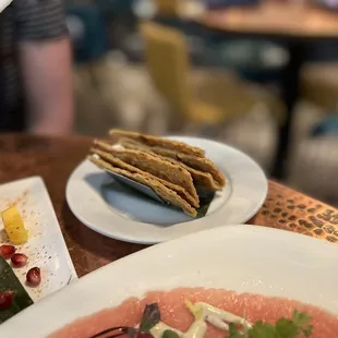 a plate of food and a drink on a table