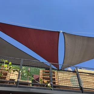 Modern design! Triangular shades with tension wire.