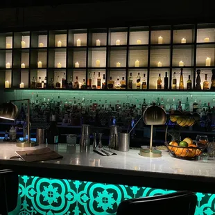 a bar with a variety of drinks