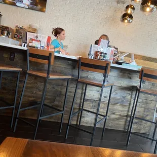 a woman sitting at the bar