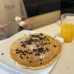 Chocolate chip pancake and freshly squeezed orange juice