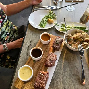 Steak flight, asparagus, Yukon potatoes