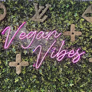 a neon sign that says vega vibes