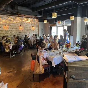 a large group of people sitting at tables