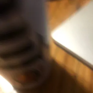 a blurry image of a person's feet and a laptop