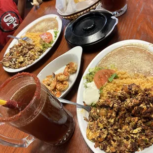 Chorizo and eggs and bacon and eggs plates shrimp for the micheladas!