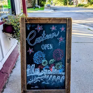 a chalkboard sign for a restaurant
