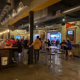 a group of people sitting at the bar