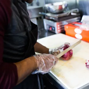 a woman chopping onions