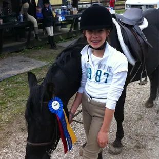 Brianna and Her Champion Ribbon on Darky!