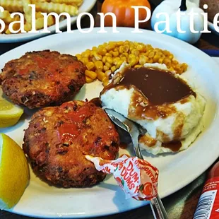 salmon patties, mashed potatoes and corn