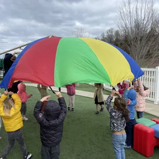 Enjoying a windy day and learning about the effects of the strong wind on a parachute!