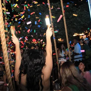 a woman on a swing at a party