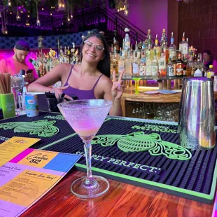 a woman sitting at a bar