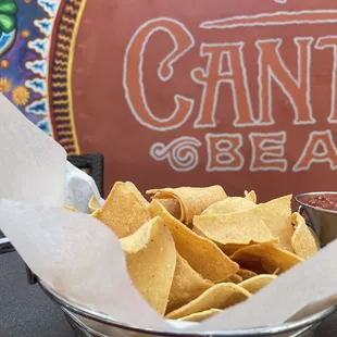 a bowl of tortillas and salsa