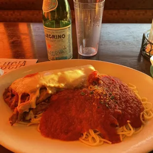 a plate of spaghetti with meat and sauce