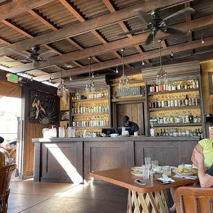 a woman sitting at a bar