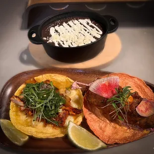 Pastor &amp; Baja Sea Bass Tacos with a side of refried black beans delicious!
