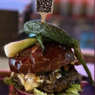 a hamburger with a qr code on top