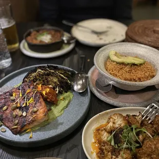 Grilled salmon, roasted cauliflower, birria and Spanish rice