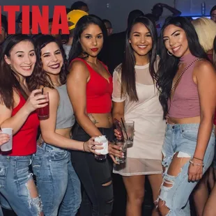 a group of women posing for a picture