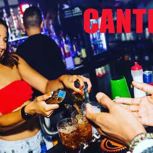 a woman pouring a drink