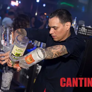 a bartender pouring a drink