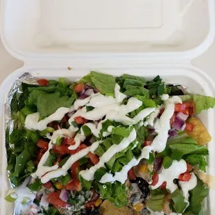 Loaded Nacho's (everything except Jalapeno's) with steak and shrimp.