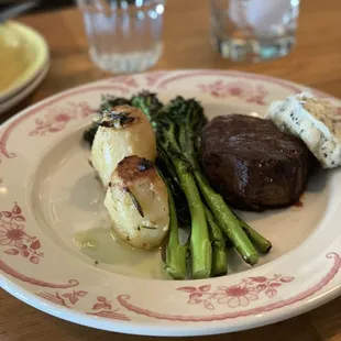 Petit filet with black truffle butter, fondant potatoes and charred broccolini