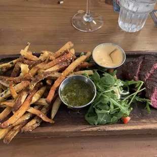 Steak frites... appear to be &quot;twice fried&quot; and seasoned with truffle oil. Chimichurra sauce for the steak and a Sriracha aioli for the fries