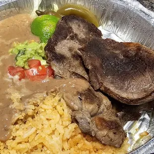 Chile Rellenos with Spanish rice and refried beans.