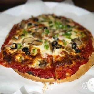 a pizza with mushrooms and olives