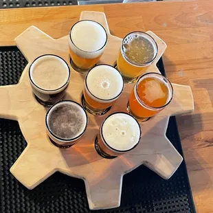 a selection of beers on a cutting board