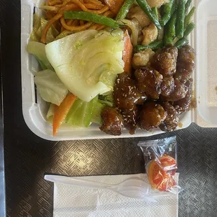 Chicken  W. string Bean , sesame chicken ,steamed mixed vegetables and noodles.